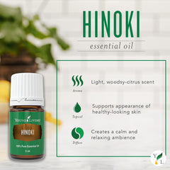 Young Living Hinoki essential oil diffuser at a work desk for focus.