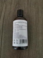 Close-up of HIQILI rosemary essential oil bottle for diffuser