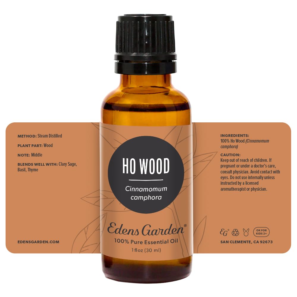 Premium-grade undiluted Ho Wood essential oil bottle on white background