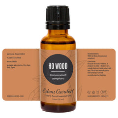 Premium-grade undiluted Ho Wood essential oil bottle on white background