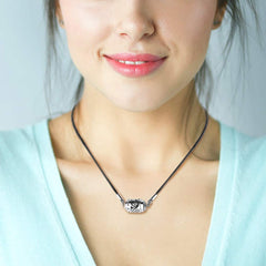 Close-up of Home-Cloud 316L stainless steel pendant detailing durability and finish