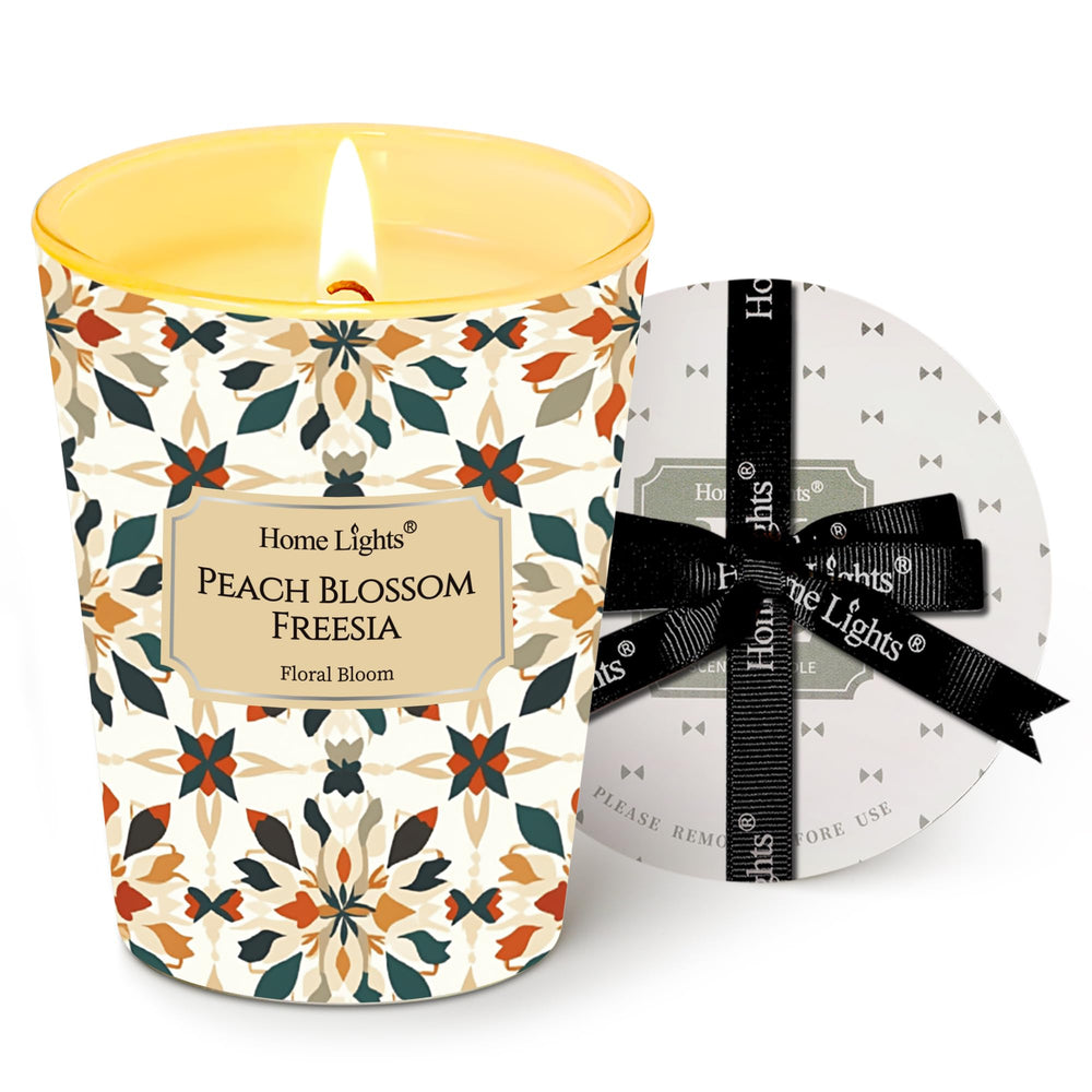 HomeLights Peach Blossom Freesia 6.7oz candle in a clear jar - front view