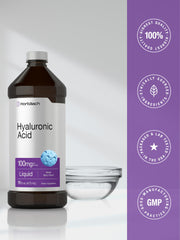 Glass serving with mixed berries beside Horbaach liquid Hyaluronic Acid