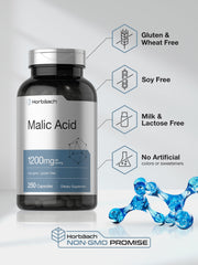 Malic acid capsules spilling from bottle for display
