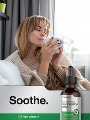 Marshmallow root tincture being displayed with a glass