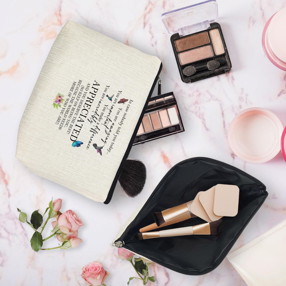 huester makeup bag linen texture close-up highlighting durable material.
