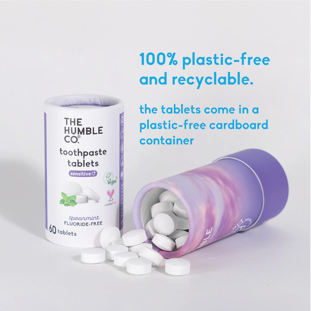 Wet toothbrush and a chewed toothpaste tablet ready to brush