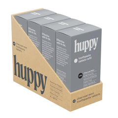 HUPPY Charcoal Toothpaste Tablets in a metal travel tin
