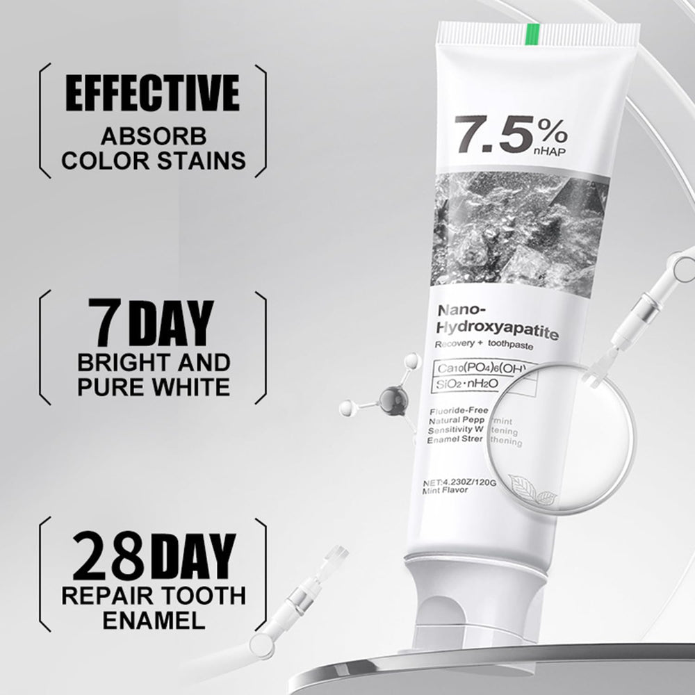 Toothbrush applying hydroxyapatite toothpaste for gentle cleaning