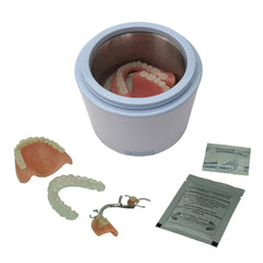 Tank filled with dentures for cleaning