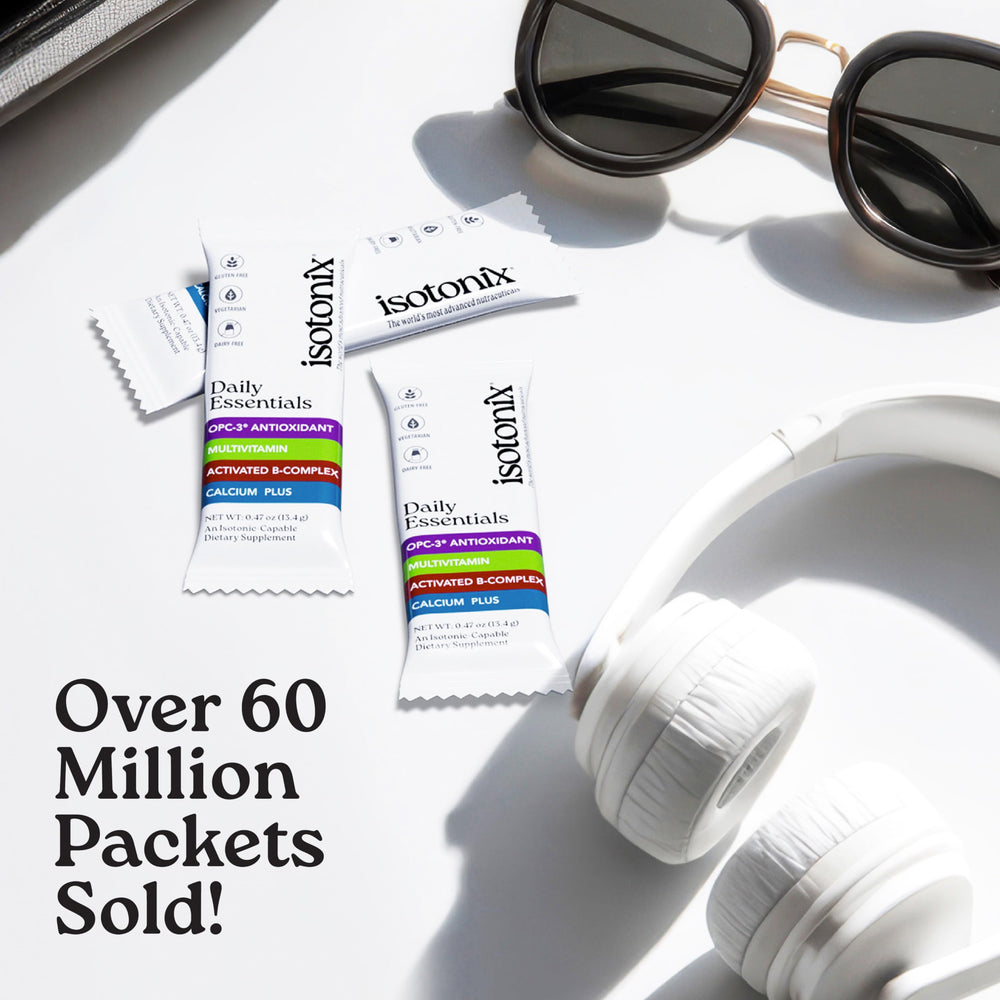 Isotonix Daily Essentials powder packets dissolving in water quickly.