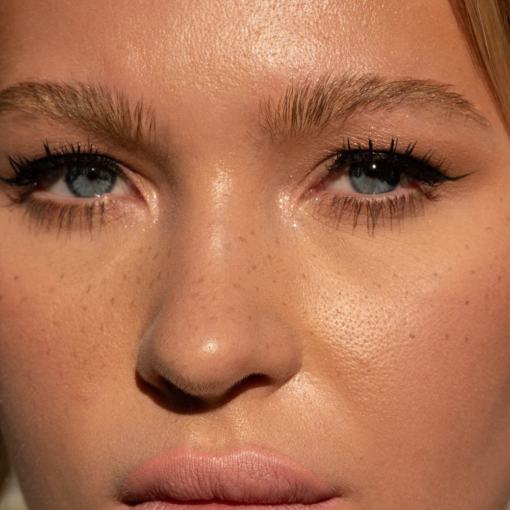 Close-up of Jason Wu Free-Da Brow dual-sided brush for precise brow shaping.
