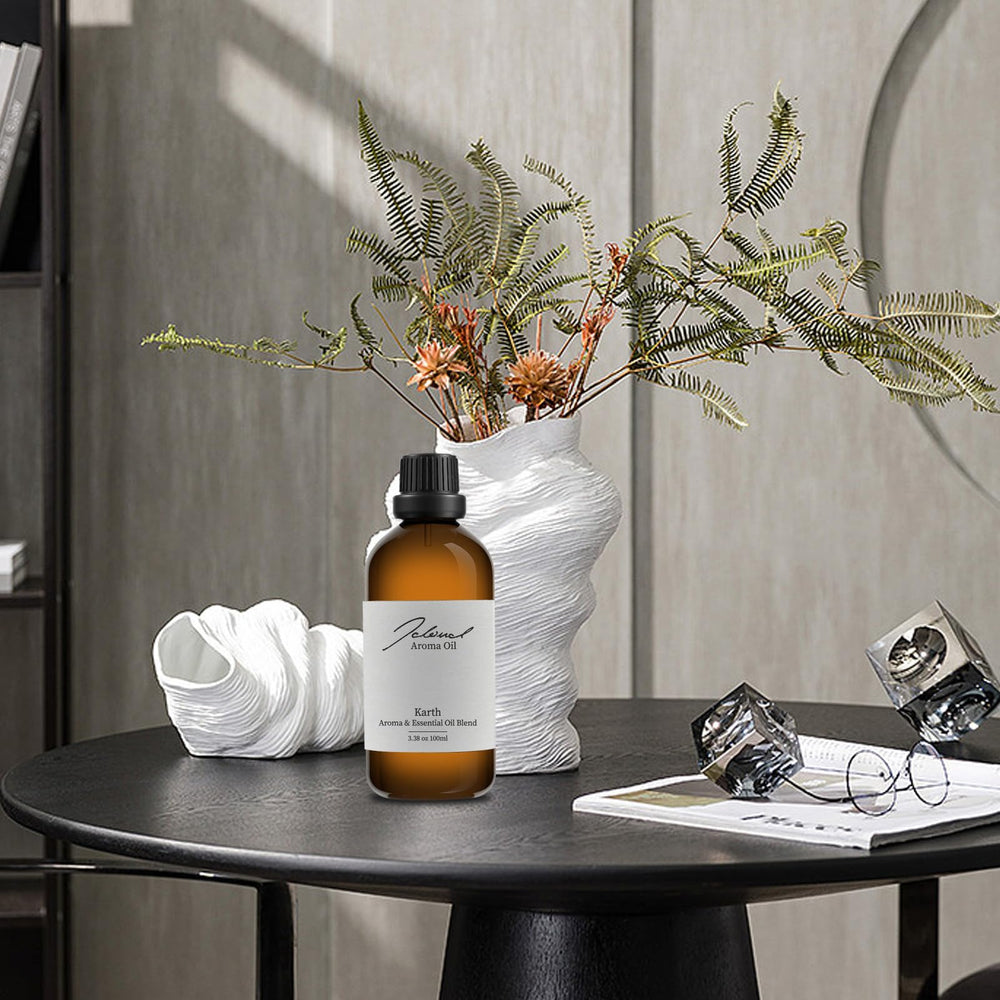 Aromatherapy diffuser releasing bergamot, orange, and amber notes