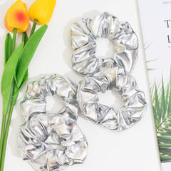 Jeffan mermaid-inspired silver scrunchie highlighting shiny style for routines