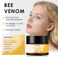 JIAYIGOOD Bee Venom Cream bottle beside botanical extracts signals clean formulation