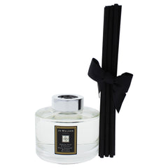 Close-up of English Pear and Freesia diffuser reeds and label