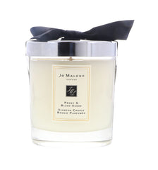 Jo Malone Peony & Blush Suede candle with peony bloom creates luxurious room ambience.