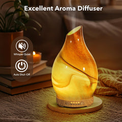 Close-up of dessert-pattern glass diffuser showing yellow and brown waves