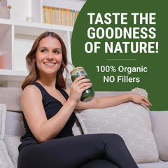 Mixing greens powder into a bottle with a straw