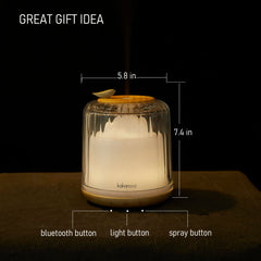 Close-up of glass dome and wood base on Kakoda essential oil diffuser