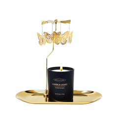 Elegant black glass candle with gold text in premium packaging