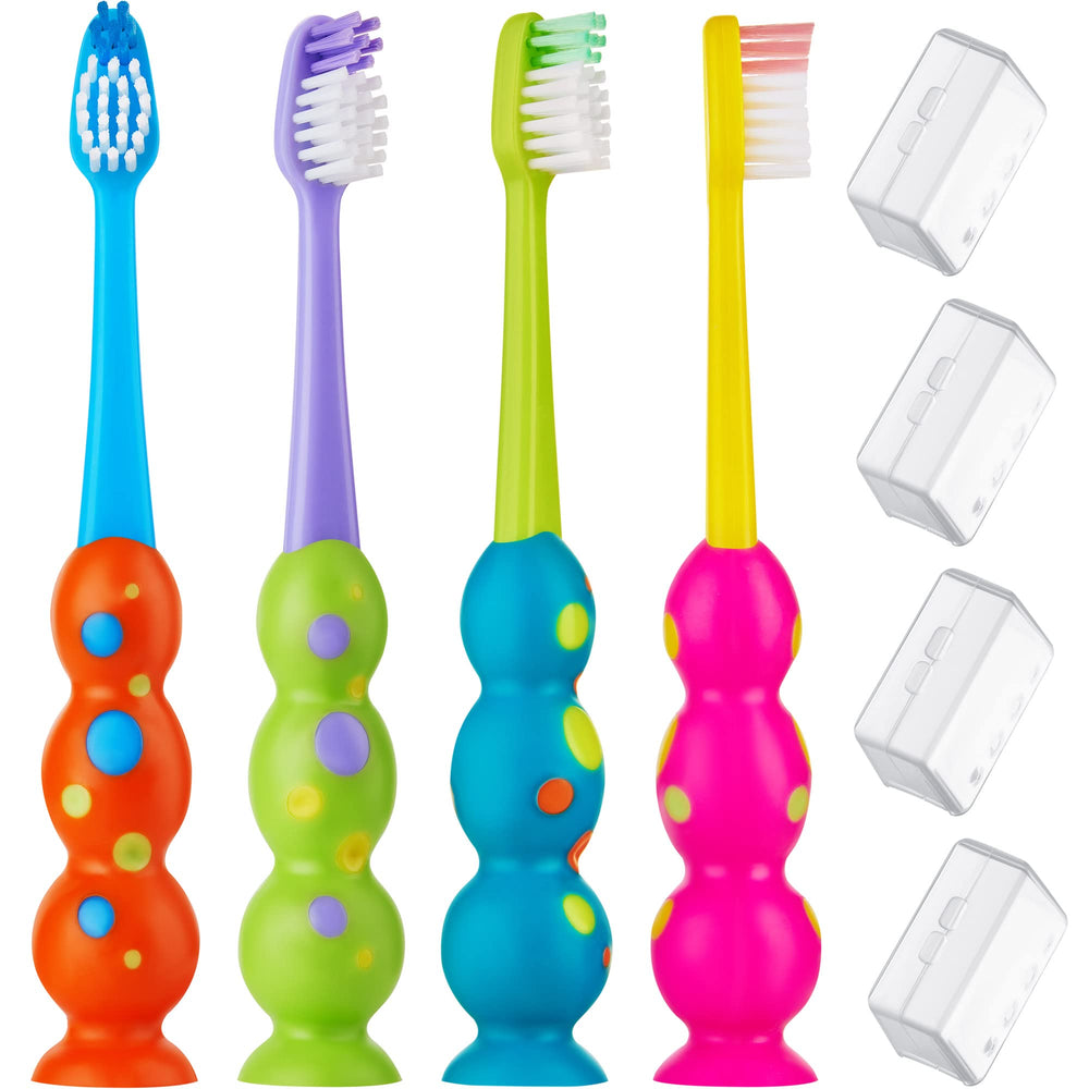 Four colorful kids toothbrushes in a 4-pack with suction cups