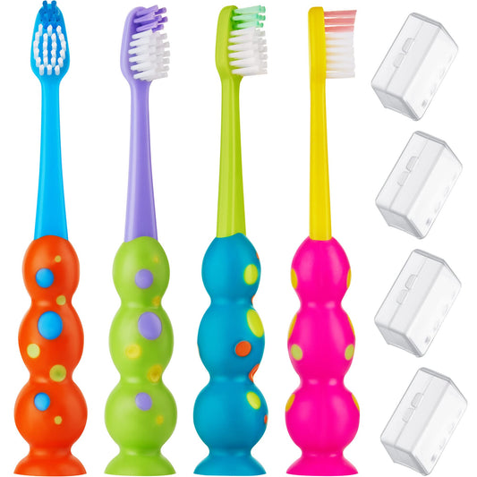 Four colorful kids toothbrushes in a 4-pack with suction cups