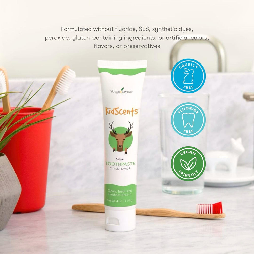 Happy child brushing teeth with citrus-mint toothpaste