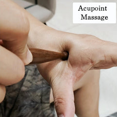 Handheld massage pen resting on palm for compact size