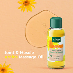 Pouring Kneipp Arnica Massage Oil onto the palm