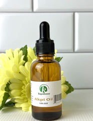 Applying Akpi oil on skin for firming and sculpting