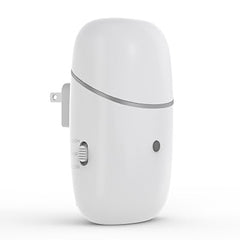 Kuandawei plug-in waterless diffuser plugged into wall outlet showing wall-mount design and aroma potential