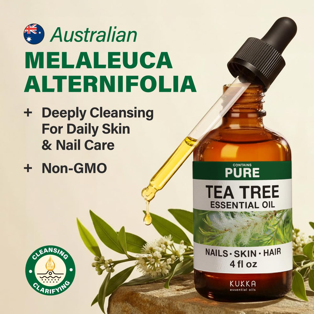 Close up of tea tree essential oil dropping from a dropper