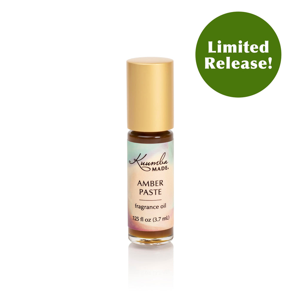Amber paste fragrance oil roller being applied