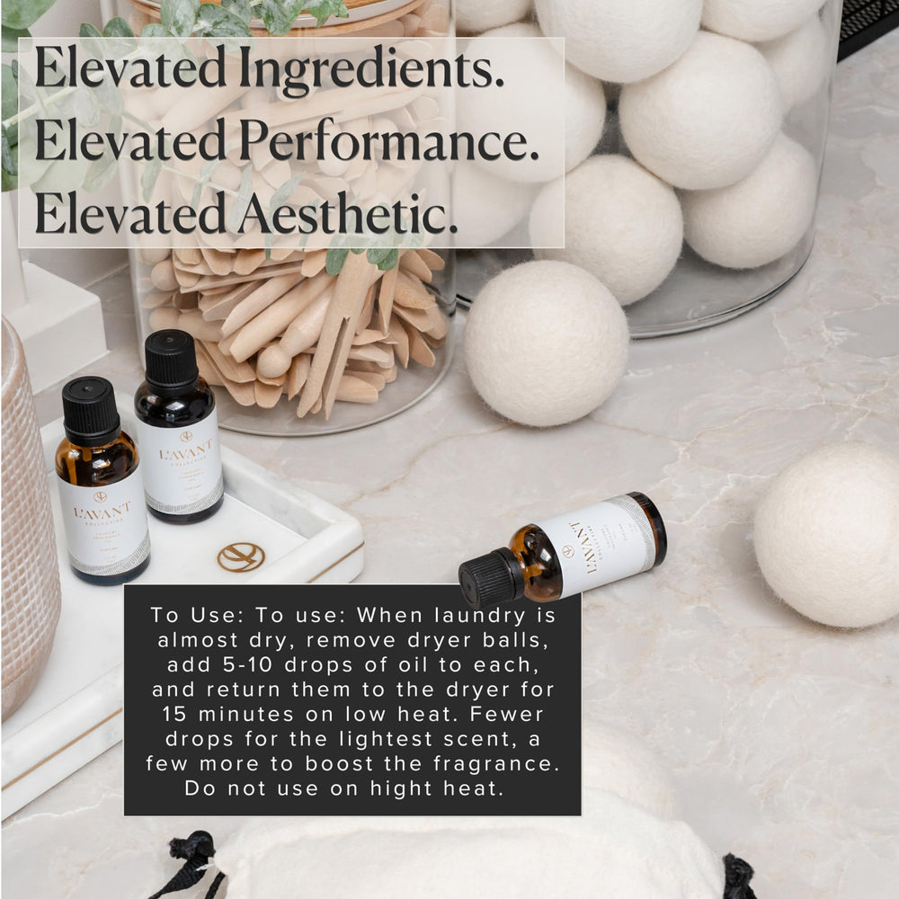 Wool dryer balls with oil droplets for scenting laundry