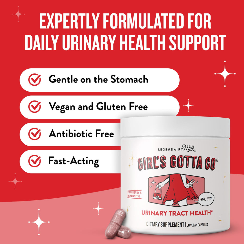 Woman taking a UTI support capsule