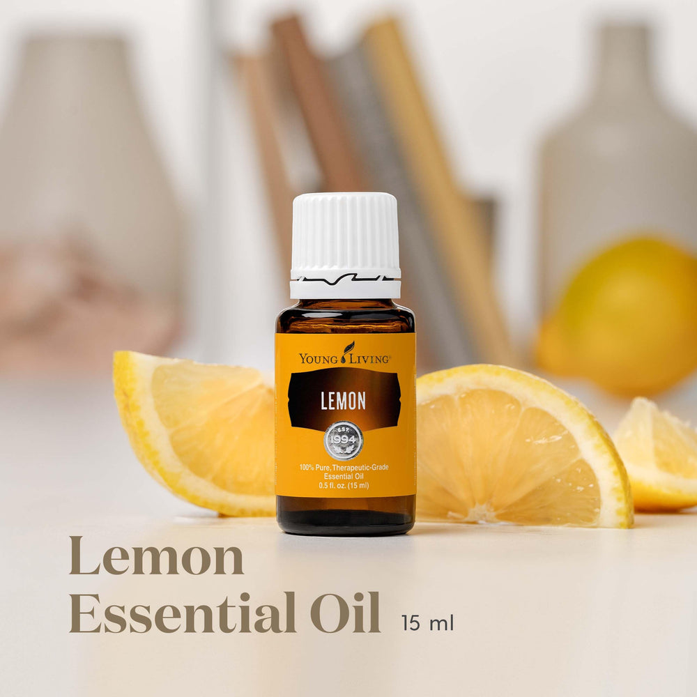 Lemon essential oil bottle with lemon slices