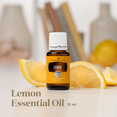 Lemon essential oil bottle with lemon slices
