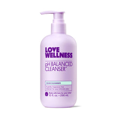 Love Wellness pH Balancing Cleanser bottle close-up shows gentle cleansing for sensitive skin