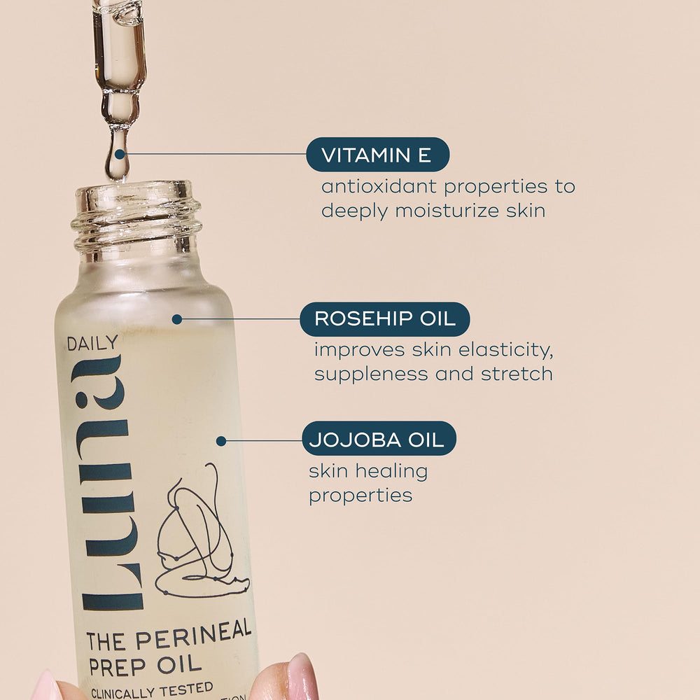 Hands applying Luna Birth Prep Massage Oil during prenatal care