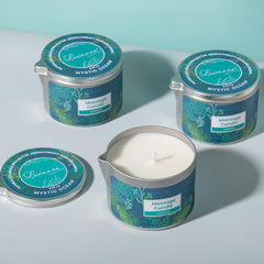 Pouring warm massage oil from candle into hand