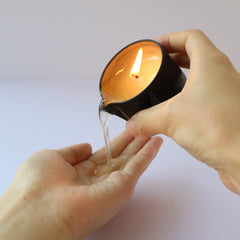 4 in 1 candle showing uses: illumination, scent, skin care, massage