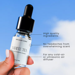 Amber diffuser oil bottle with black cap in soft lighting