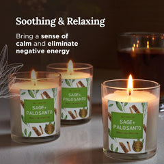 Soft glow of Sage and Palo Santo candles burning for energy cleansing