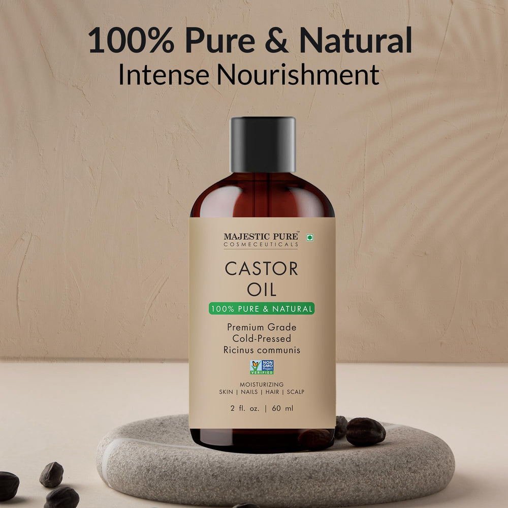 Translucent pale yellow castor oil inside a clear bottle