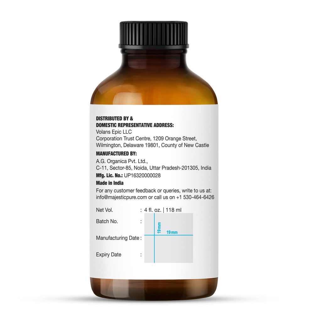 Label close-up of Majestic Pure Brazilian Orange Essential Oil bottle.