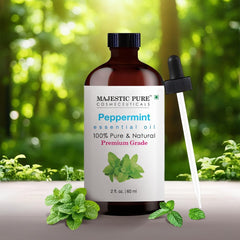 Amber bottle of Majestic Pure Peppermint Oil with dropper close-up