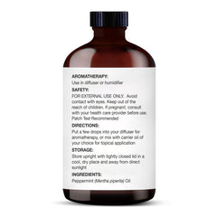Glass dropper dispensing peppermint essential oil