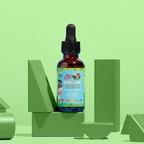 Dropper dispensing probiotic drops into glass