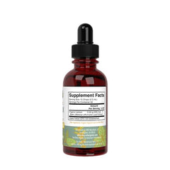 Lemon balm liquid extract bottle placed near glass and surrounding setup